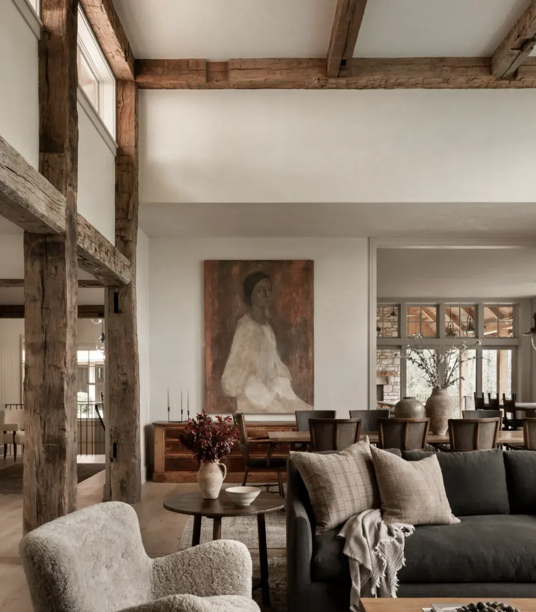 Amber Interiors — timber-beamed living room with portrait